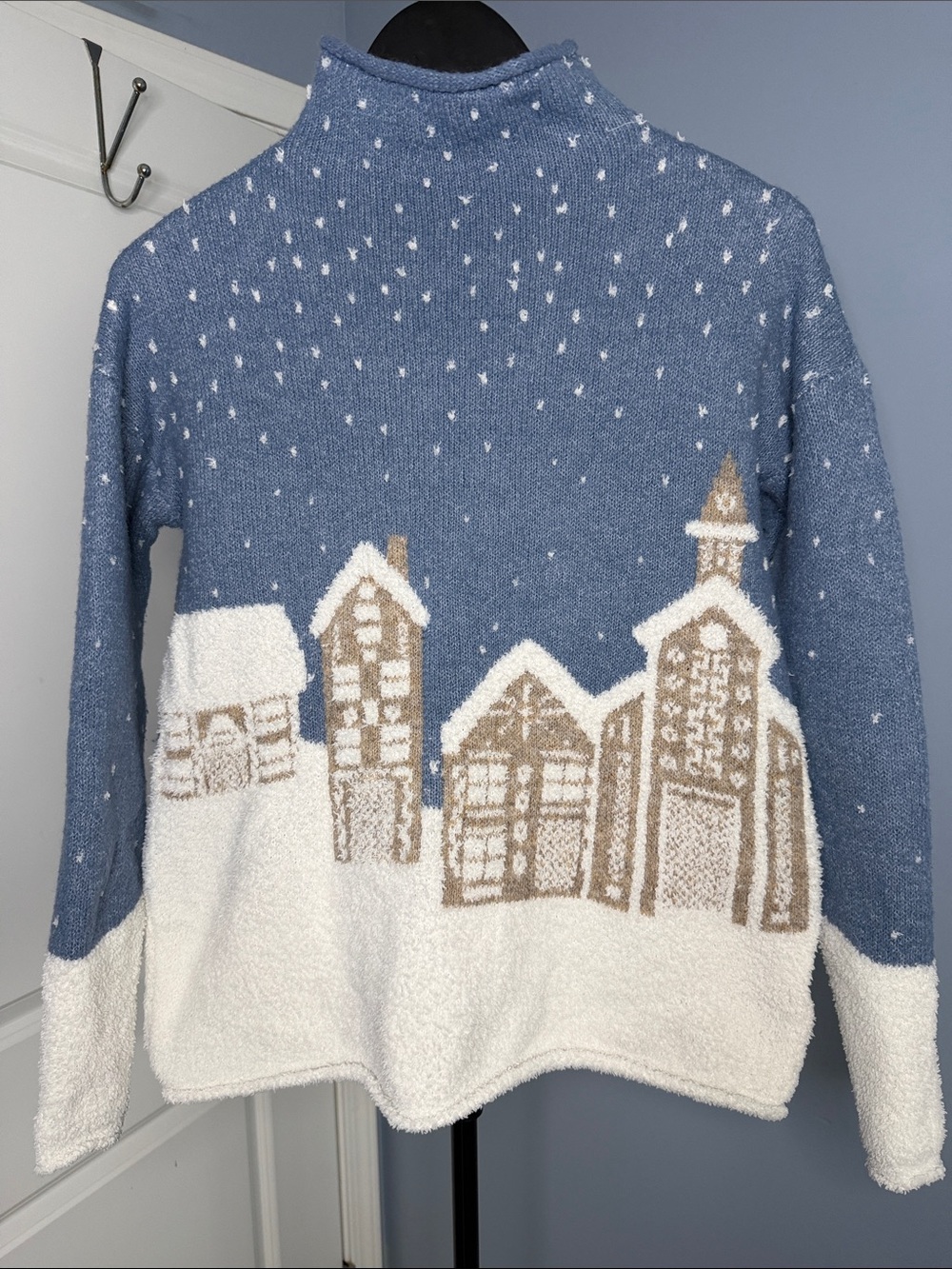 cupcakes & cashmere Blue Mock Neck Sweater with White and Tan Village Motif